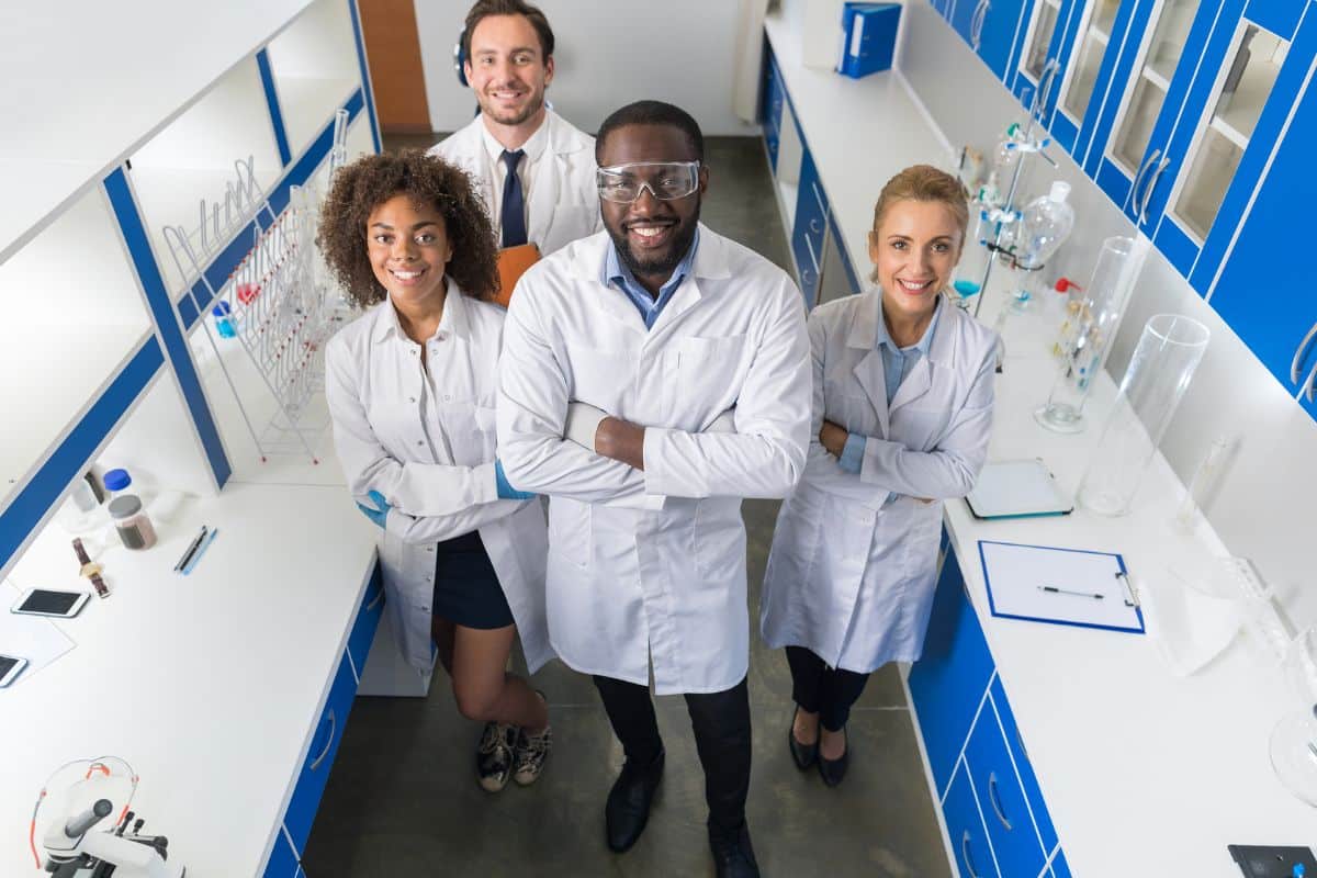 a clinical team standing in a laboratory